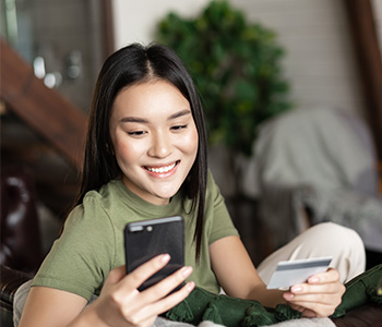 happy woman with credit card